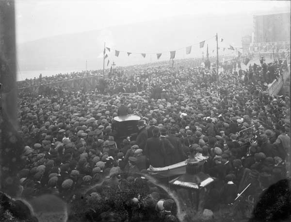 The passage of Home Rule in 1914 is as certain 'as the spring will succeed the winter gloom', John Redmond has told a nationalist rally in Waterford. Here, in a photograph from 1913, he  addresses an equally large crowd at the opening of a new bridge, also in his home constituency.