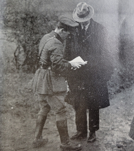 IRA officer examining pedestrian’s passport on the border at Clones