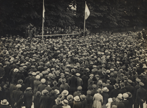 Crowds at an election rally in St. Stephen’s Green, 1923. Seated on the platform are, amongst others, Eoin MacNeill, Hugh Kennedy and W. T. Cosgrave. The speaker addressing the crowd may be Kevin O'Higgins. CA. 1923