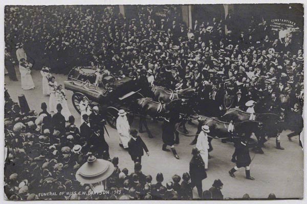 Crowds line the streets of London for the funeral of suffragette Emily Davison
